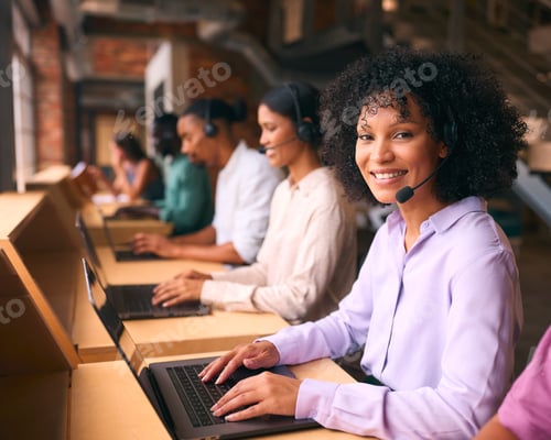 Preview: Portrait Of Customer Support Or Telesales Team In Modern Open Plan Office Wearing Headsets