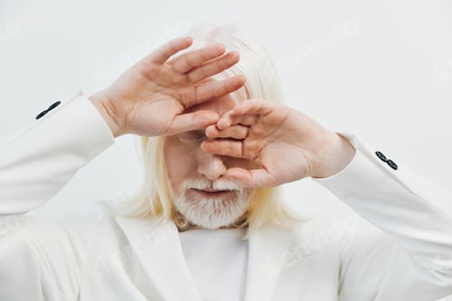 Preview: Stylish elderly man with white hair and beard covering his face, dressed in a white suit The image