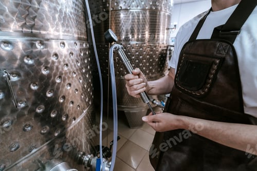 Preview: Modern winery with metal barrels.