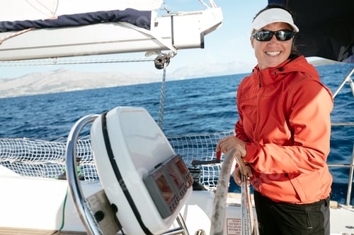 Preview: Attractive strong woman sailing with her boat