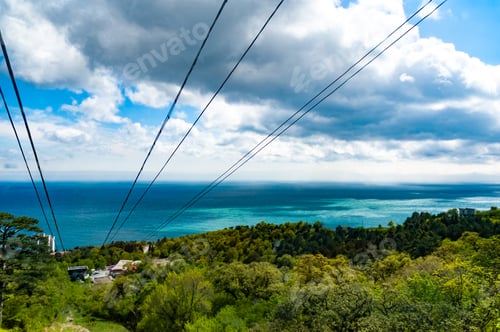 Preview: Funicular paths pass by picturesque thickets background of sea