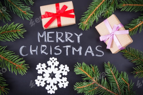 Preview: Christmas Gifts and Evergreen Sprigs on Black Background