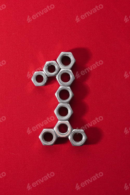 Preview: number one, made with steel nuts on red fabric background