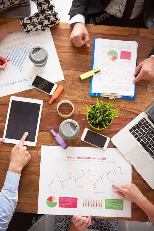 Preview: Business people working over some documents