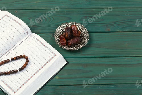 Preview: The Open holy Quran with tasbih rosary beads