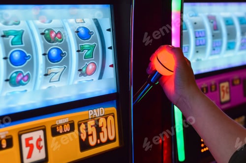 Preview: Female hand arm playing slot machine at casino
