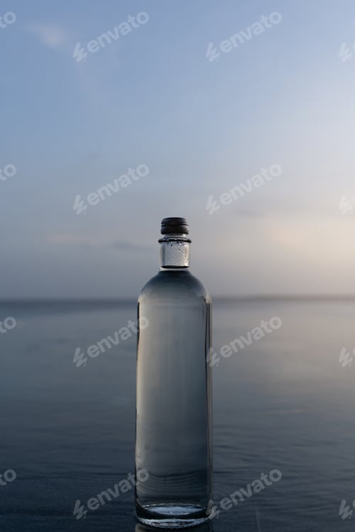 Preview: Glass Water Bottle by Infinity Pool Overlooking the Ocea