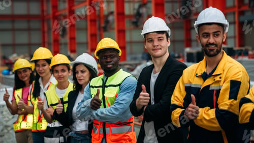 Preview: Portrait of industrial worker inspecting and check up machine at factory machines.