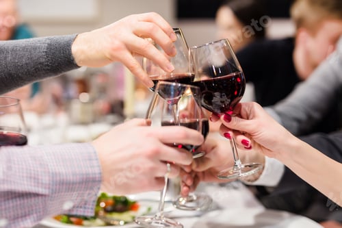 Preview: Clinking glasses of wine. Cheers after speech. Party at cafe or restaurant. Family celebration or an