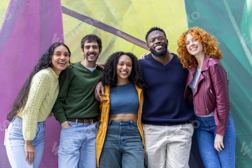 Preview: Smiling Friends Gathering Together Against Colorful Wall