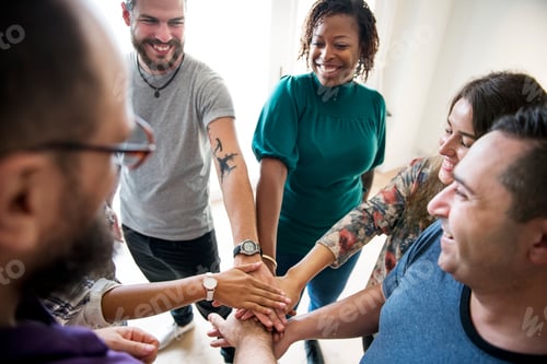 Preview: Group of diverse people joined hands together teamwork