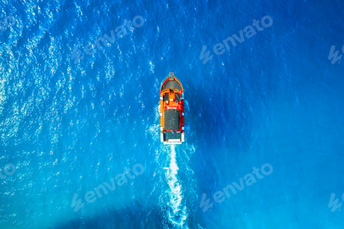 Preview: Aerial view on fast boat on blue sea at sunny day. Seascape with motorboat.