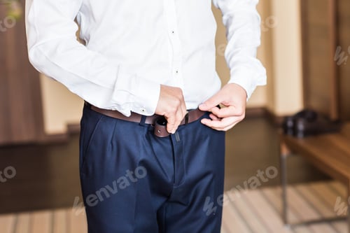 Preview: Man with belt close-up
