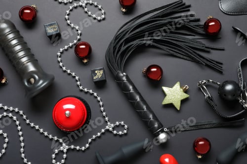 Preview: Set of different sex toys and Christmas decorations on black background, flat lay