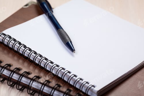 Preview: Blank note paper with pen on wood background