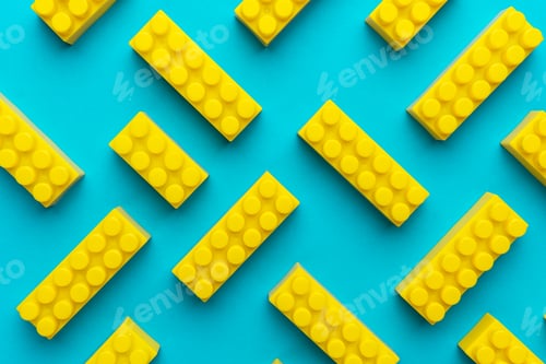 Preview: Yellow Plastic Building Blocks Background On Turquoise Blue
