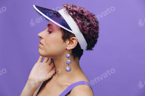 Preview: Portrait of a sporty fashion woman posing smiling in a purple sports suit for yoga and a transparent