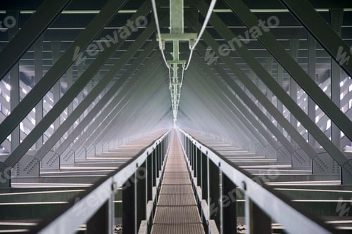 Preview: Symmetrical view of walkway below a bridge