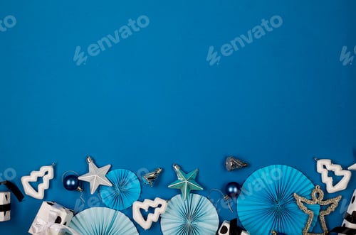 Preview: Christmas background with gift boxes, baubles, branches and ribbon on blue.