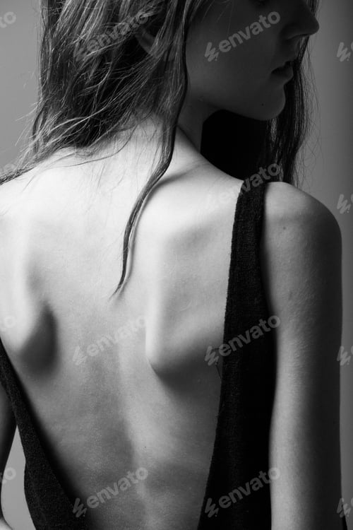 Preview: rarview of a woman's skinny back