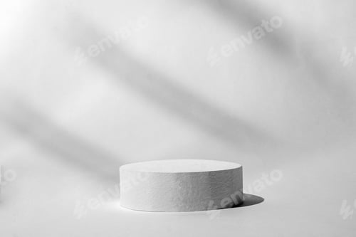 Preview: Cylinder 3D podium on a gray minimal background with shadows and light for product display