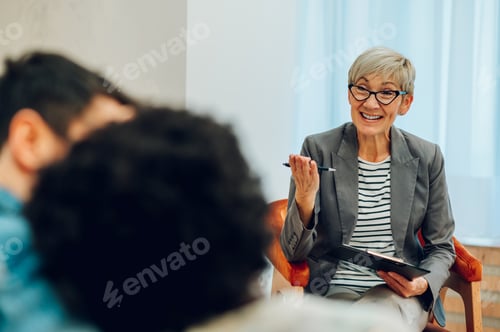 Preview: Enthusiastic Woman Meeting with Clients at Workplace