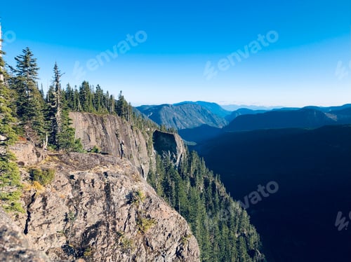 Preview: Person on cliff side rock canyon Mountain View