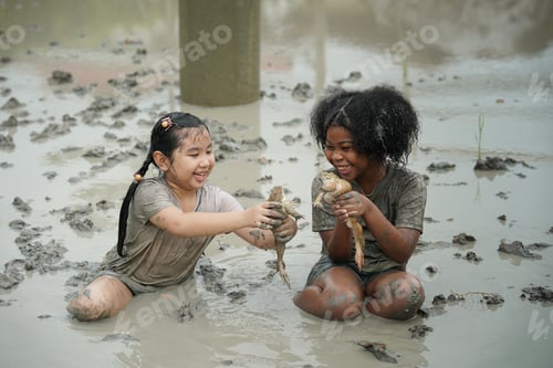 Preview: Group of happy children playing at playground