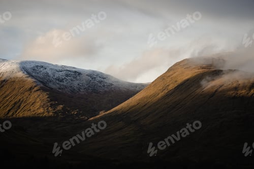 Preview: Mountains landscape in early morning fog and clouds in the Scottish Highlands