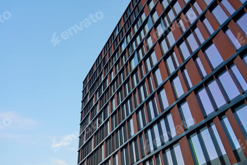 Preview: Modern office building exterior reflecting blue sky. Contemporary architecture
