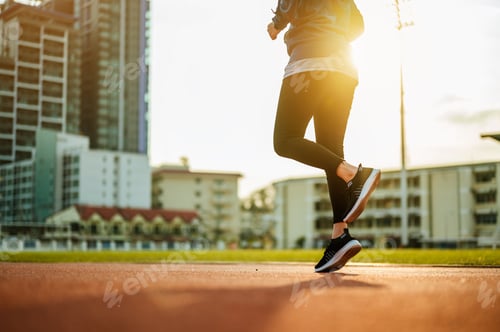 Preview: Runner jogging in sun light.Asian woman fitness model training in the morning in the city.Jogging,Ru