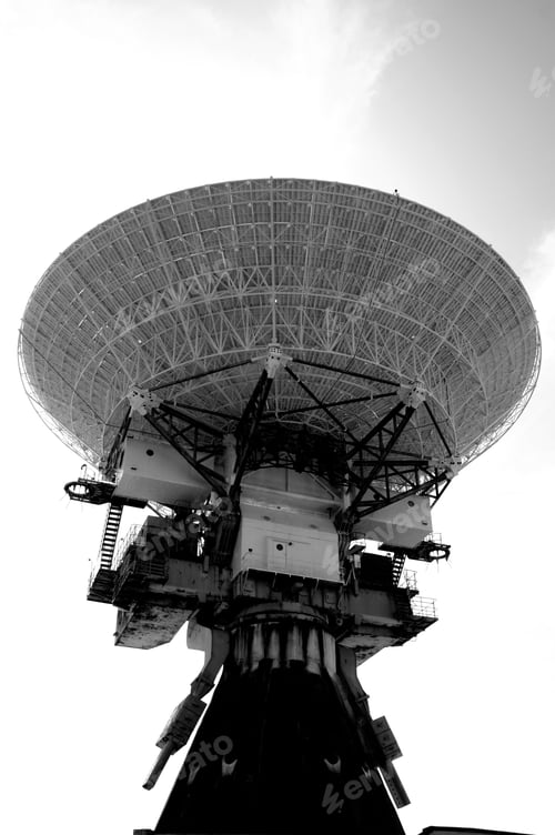 Preview: Vertical grayscale shot of a telescope with sunny sky in the background