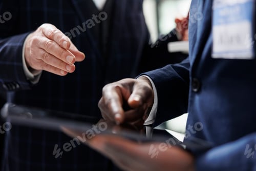 Preview: African american store manager checking product inventory