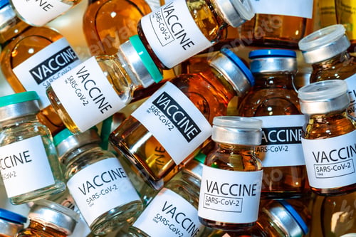 Preview: Vaccine vials of Sars-cov-2 on table in laboratory