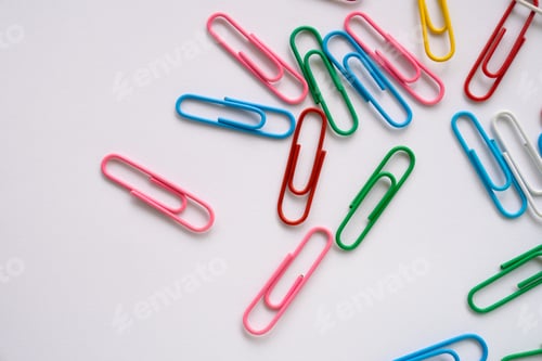 Preview: Colored paper clips close-up on a white background