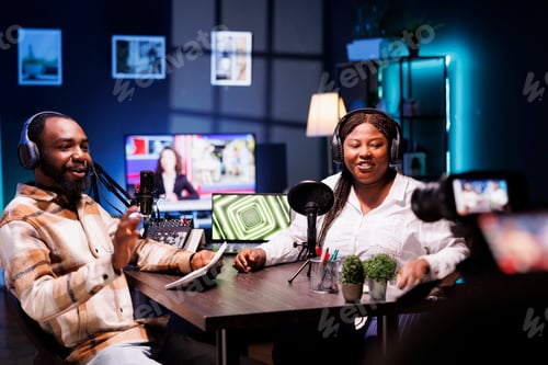 Preview: Presenter uses camera to produce podcast