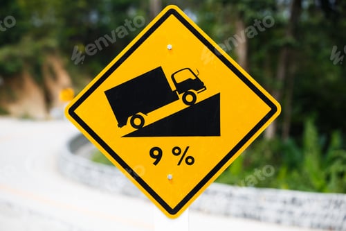 Preview: Steep roadsign on the road on an exotic island.