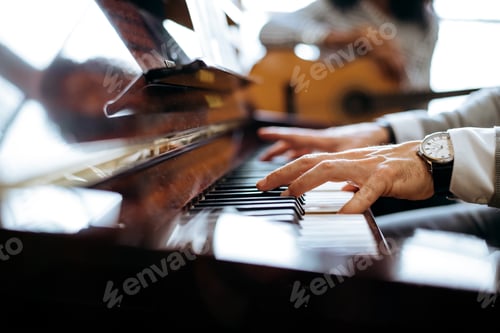 Preview: Crop male hands playing piano
