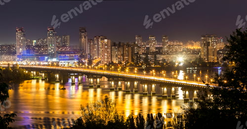 Preview: Kyiv (Kiev) city, the capital of Ukraine at night beside the Dnipro (Dniepr) river