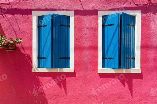 Preview: Pink walled house with open wooden windows in Burano, Italy