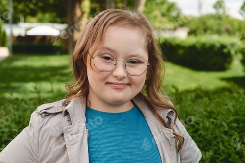 Preview: A Young Girls Radiant Smile in the Park