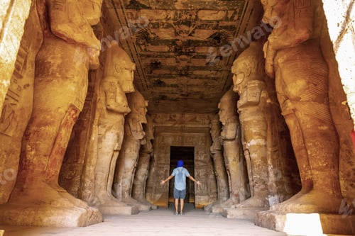 Preview: A young tourist looking at the pharaohs at the Abu Simbel Temple in southern Egypt