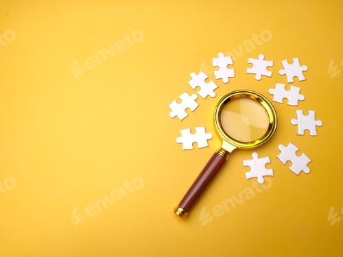 Preview: Magnifying glass searching missing puzzle on yellow background