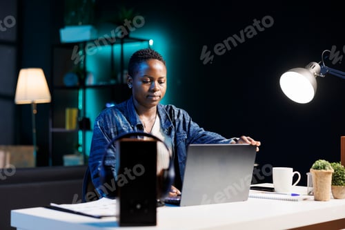 Preview: Woman holds a laptop screen