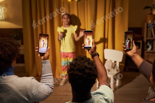 Preview: Parents Holding Smartphones Recording Children In Show