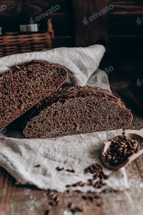 Preview: Dark Bread Slices with Seeds on Linen Fabric