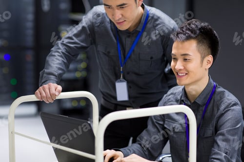 Preview: Businessman using laptop in computer room