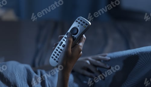 Preview: Woman watching tv at night