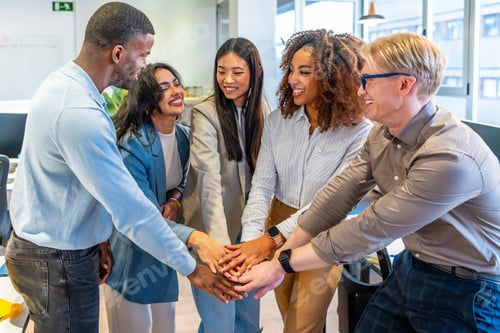 Preview: Startup business team joining hands in coworking office, celebrating success and teamwork