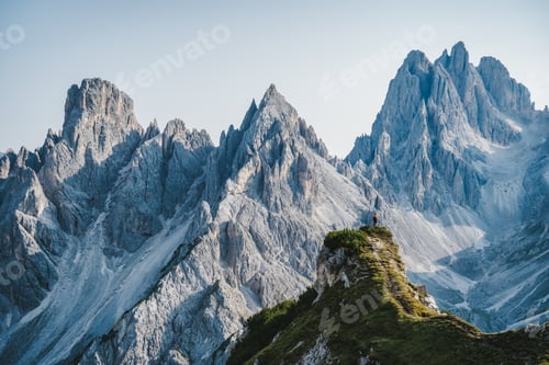 Preview: Man hiker standing and admiring stunning beauty of impressive jagged peaks of Cadini di misurina